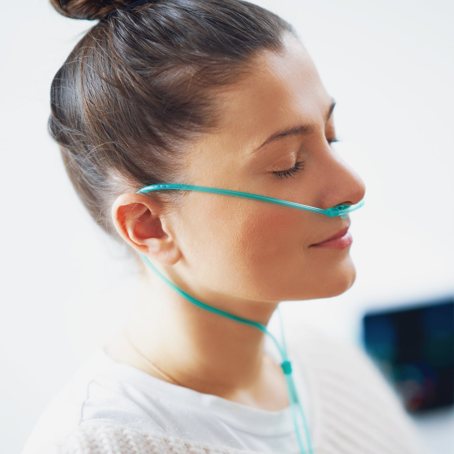 Female smiling while wearing nasal cannula